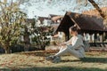 Young Fashionable Teenage Girl With Smartphone In Europian Park In Autumn Sitting At Smiling. Trendy Young Woman In Fall Royalty Free Stock Photo