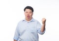 Young Fat Asian business man raising his fists with funny face isolated on white background. Royalty Free Stock Photo