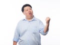 Young Fat Asian business man raising his fists with funny face isolated on white background. Royalty Free Stock Photo