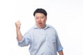 Young Fat Asian business man raising his fists with funny face isolated on white background. Royalty Free Stock Photo