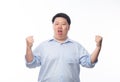 Young Fat Asian business man raising his fists with funny face isolated on white background. Royalty Free Stock Photo