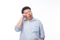 Young Fat Asian business man thinking with doubts face isolated on white background. Royalty Free Stock Photo