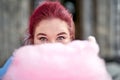 Young fat woman covering face with cottong candy Royalty Free Stock Photo