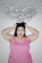 Fat woman frustrated with chaos sign Royalty Free Stock Photo