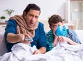 Young father caring for sick son Royalty Free Stock Photo