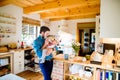 Young father carrying and feeding his newborn baby son Royalty Free Stock Photo