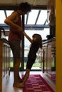 Young father and child girl dancing in the kitchen. Vertical shot Royalty Free Stock Photo