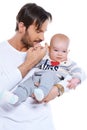 Young father cradling his baby on his arm Royalty Free Stock Photo