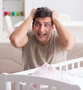 Young father dad frustrated at crying baby