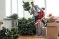 Young father with daugter decorating Christmas tree together Royalty Free Stock Photo