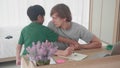 Young father drawing on book computer and son persuade play while busy at homeÃ Â¹Æ