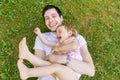 Young father have fun with his little daughter. Man and child are playing in grass Royalty Free Stock Photo