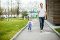 A young father with his daughter on a walk in the city park. Royalty Free Stock Photo