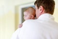 Young father and his little cute newborn baby daughter together in spa hotel. Royalty Free Stock Photo