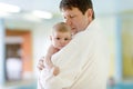 Young father and his little cute newborn baby daughter together in spa hotel. Royalty Free Stock Photo