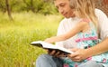 Young father with his little daughter reading the Bible Royalty Free Stock Photo