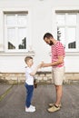 Young father and his little son eating ice cream. Sunny day. Royalty Free Stock Photo