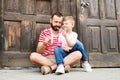 Young father and his little son eating ice cream. Sunny day. Royalty Free Stock Photo