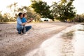 Young father and his little son fishing together at lake, family leisure Royalty Free Stock Photo