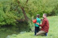 Young father and his son fishing together Royalty Free Stock Photo