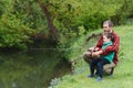 Young father and his son fishing together Royalty Free Stock Photo