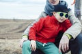 Young father with his son having fun outside in spring field, happy family smiling, lifestyle people making selfie Royalty Free Stock Photo
