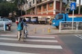 Young father and his son riding a bike together