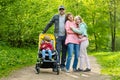 Young father and his three kids hiking in the woods. Family of four having fun on a walking trail on sunny spring day Royalty Free Stock Photo