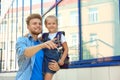 Young father holding his little child with school bag Royalty Free Stock Photo