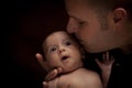 Young Father Holding His Mixed Race Newborn Baby