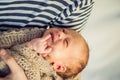Young father holding his newborn baby son in his arms Royalty Free Stock Photo