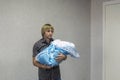 Young father holds bundle with his newborn baby in birth hospital Royalty Free Stock Photo