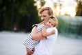 Young father holds the little daughter on hands. Royalty Free Stock Photo