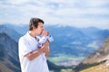 Young father kissing his newborn baby in mountains Royalty Free Stock Photo