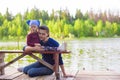 Young father and little adorable girl fishing on Royalty Free Stock Photo