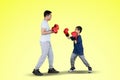 Young father and little boy doing boxing exercise