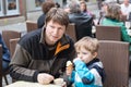 Young father and little boy eating ice cream Royalty Free Stock Photo