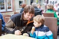 Young father and little boy eating ice cream Royalty Free Stock Photo