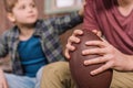 Young father with little son sitting on porch at backyard Royalty Free Stock Photo