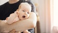 Young Father man tries to calm crying and toddler tantrum of baby girl. Concept stress parenting child Royalty Free Stock Photo