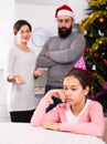 Parents lecturing daughter at Christmas Royalty Free Stock Photo