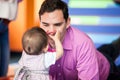 Young father playing with his baby daughter. Early stimulation for toddlers concept