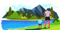 young father and son fishing with rods on lake parenting fatherhood concept dad spending time with kid Royalty Free Stock Photo