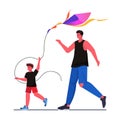 young father and son launching kite together parenting fatherhood concept dad spending time with kid