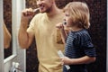 Young Father with Son Shaving Royalty Free Stock Photo