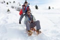 Young Father And Son Sledding