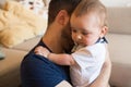 Father comforting crying baby Royalty Free Stock Photo