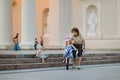 Young father teaching his daughter to ride a bike Royalty Free Stock Photo