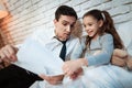 Young father tells his daughter about his work. Businessman shows little daughter than he does. Royalty Free Stock Photo