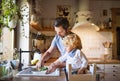 Young father with a toddler boy cooking. Royalty Free Stock Photo